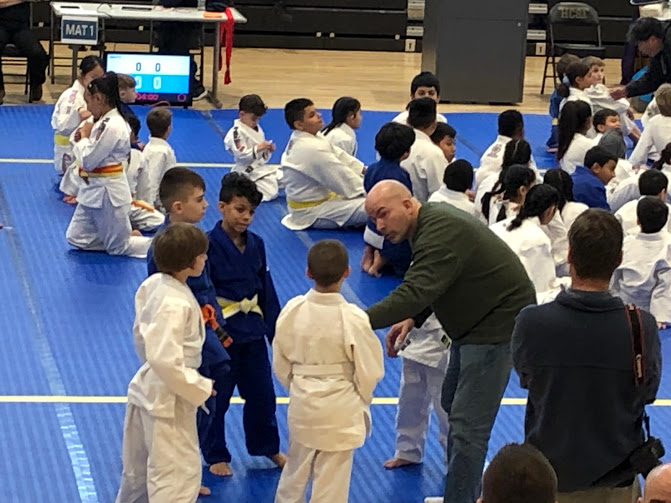Sensei Kevin Costello coaching at a kids judo competition